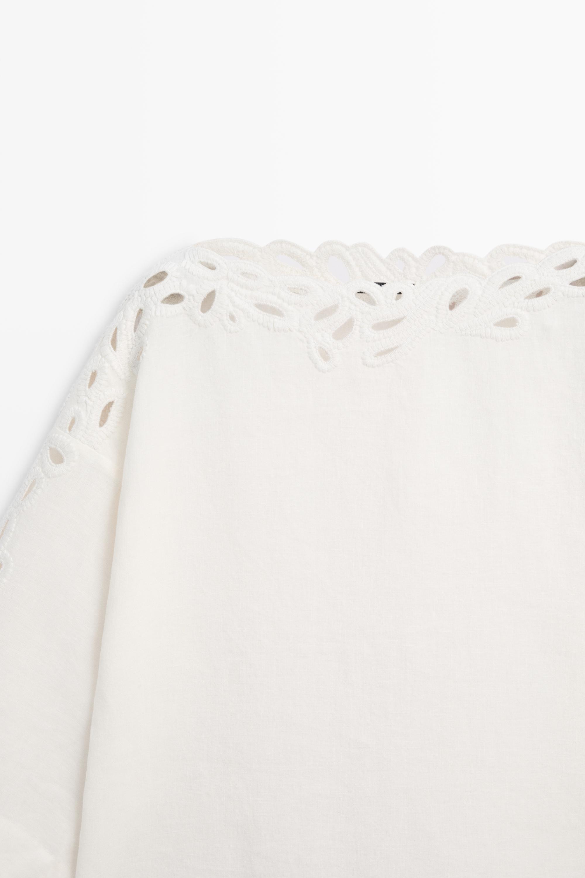 Linen boat neck blouse with embroidery